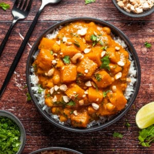 Vegan butternut squash curry in a black bowl.