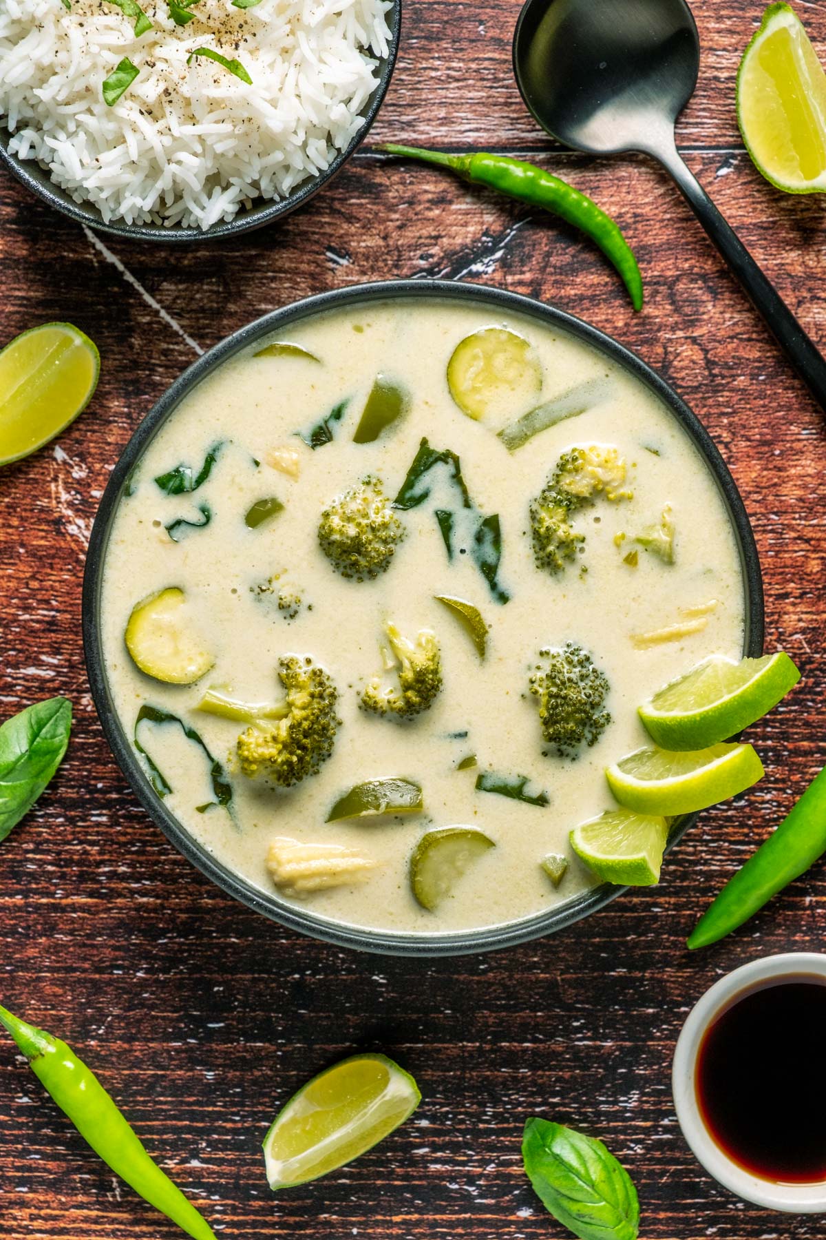 Vegan Thai green curry in a black bowl. 