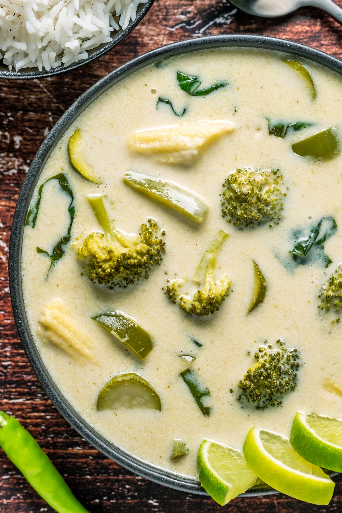 Vegan Thai green curry in a black bowl.