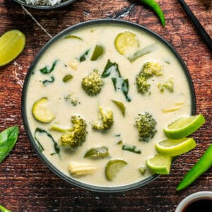 Vegan Thai green curry in a black bowl.