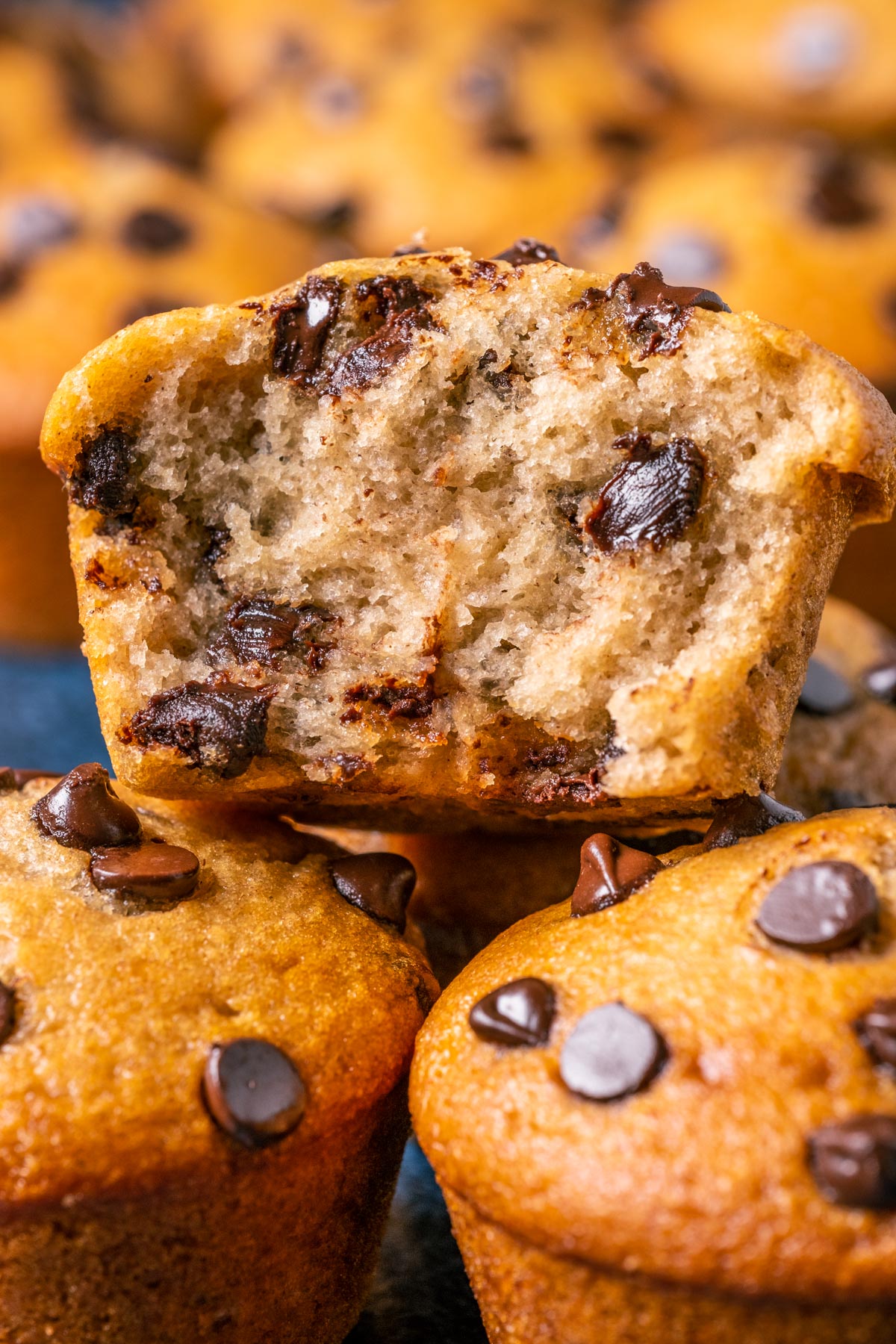 Vegan banana chocolate chip muffin broken in half.