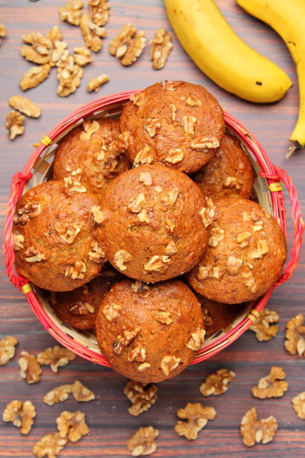 Vegan banana muffins in a woven basket. 