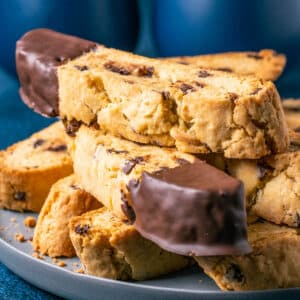 Vegan biscotti stacked up on a gray plate.