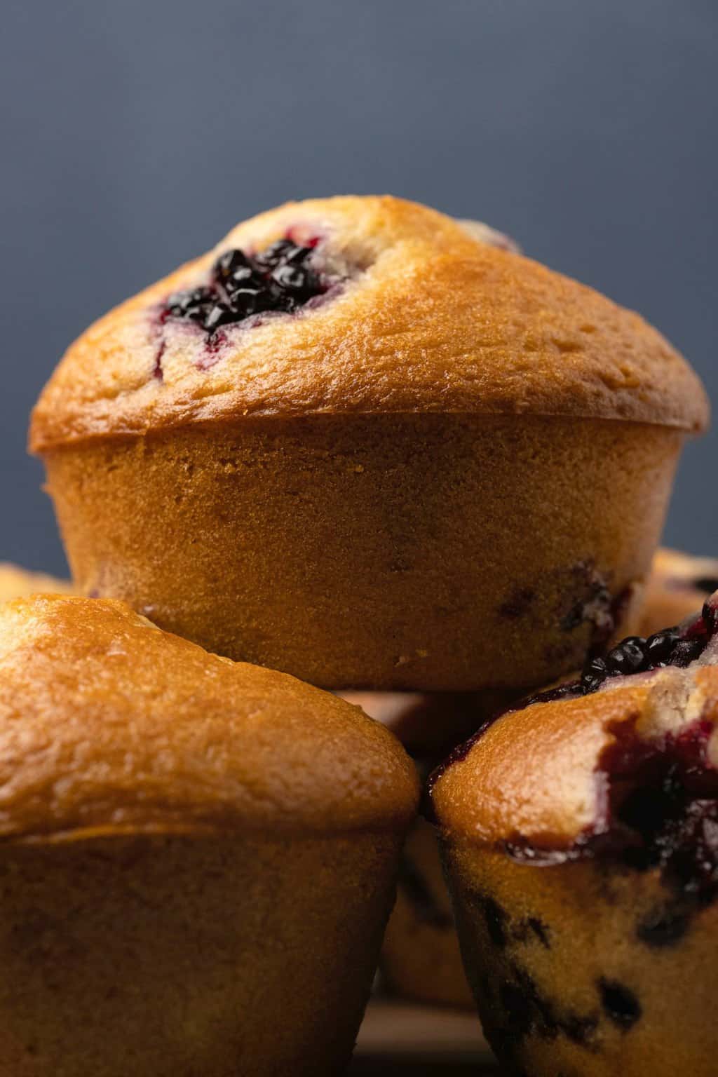 Vegan blackberry muffins in a stack. 