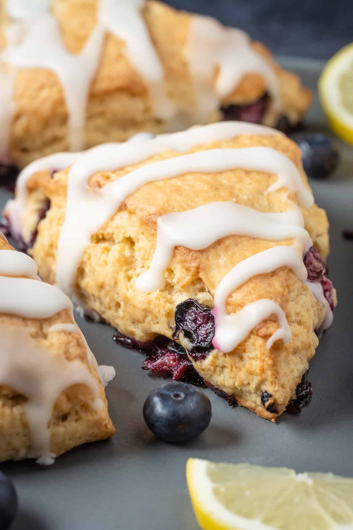 Vegan blueberry scones on a gray plate.