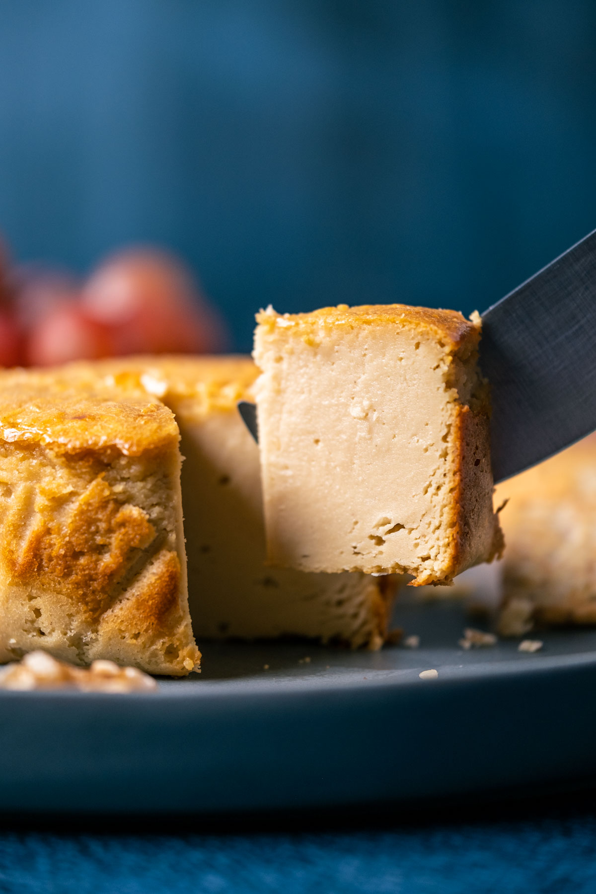 Slice of brie cheese on a knife.