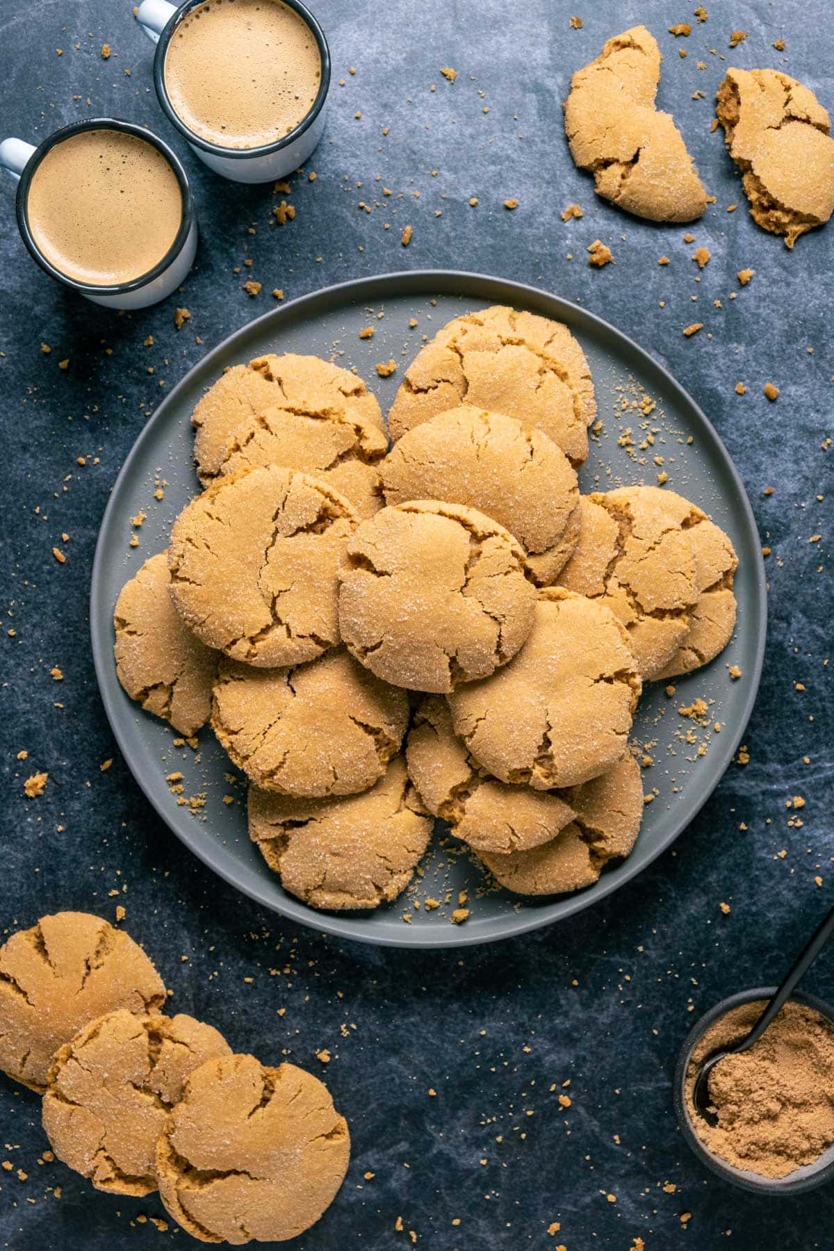 Vegan brown sugar cookies stacked up on a gray plate.