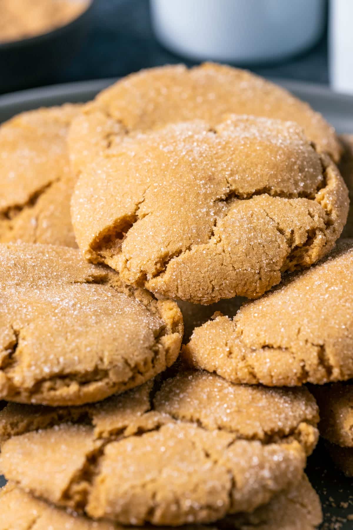 Vegan brown sugar cookies stacked up on a gray plate.