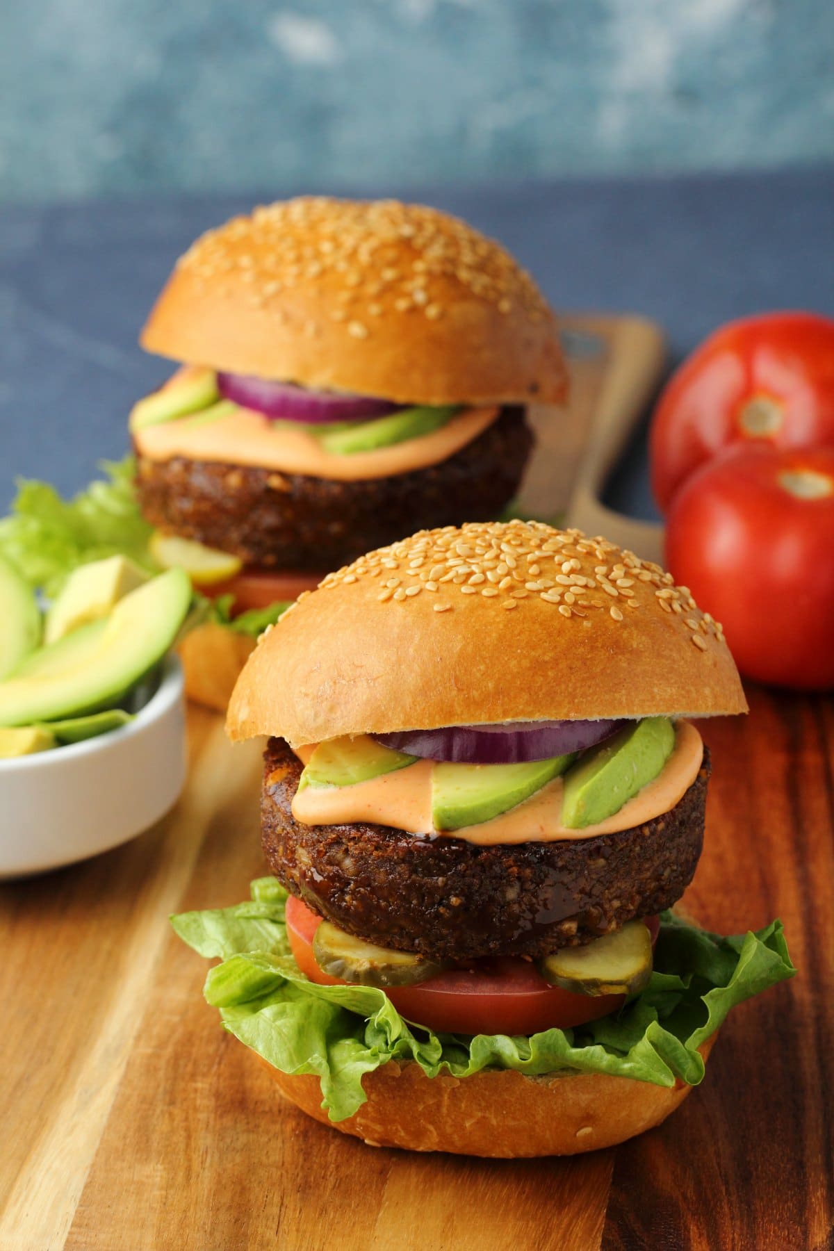 Vegan burgers on a wooden board. 