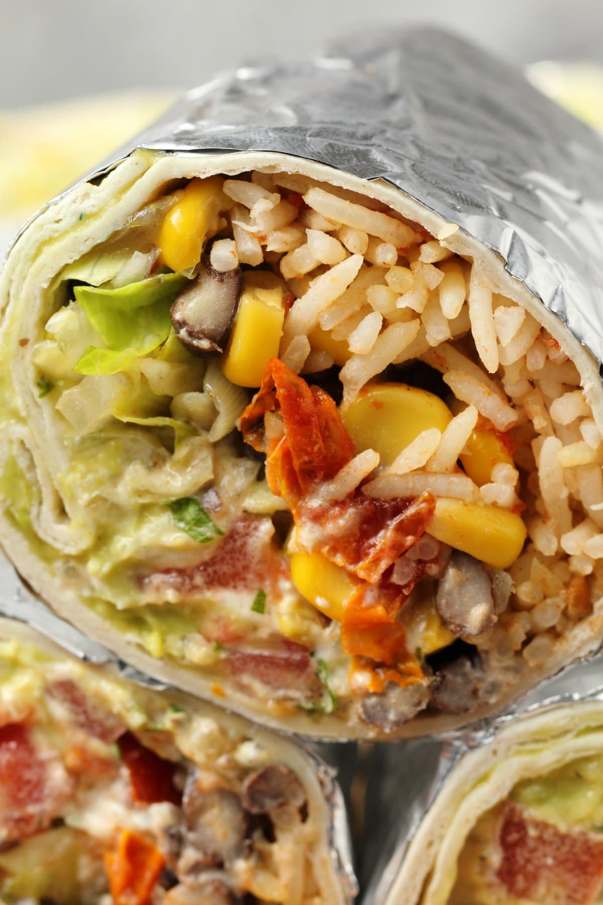 Vegan burritos stacked up. 