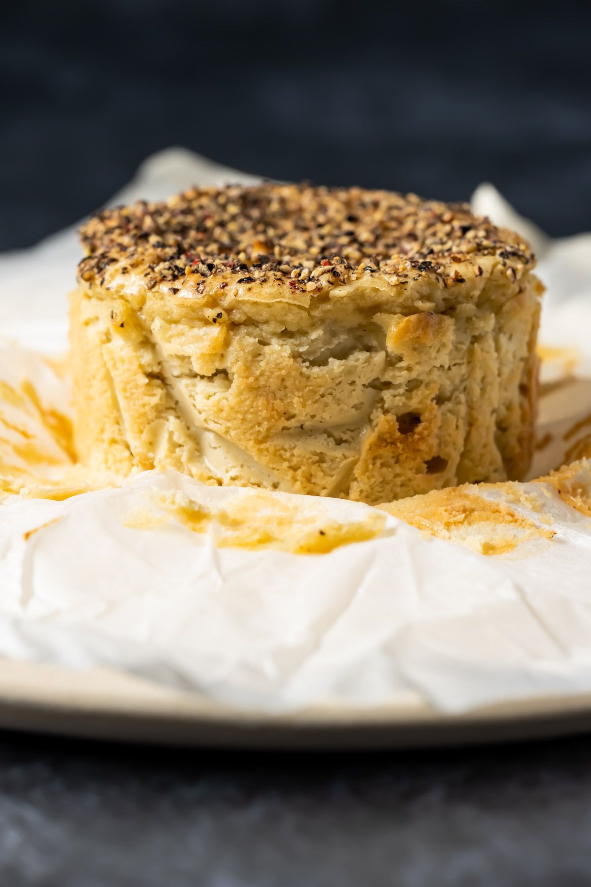 Vegan camembert on parchment paper.