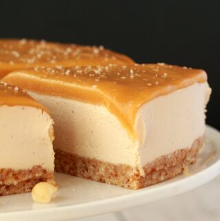 Vegan Cheesecake on a white cake stand.