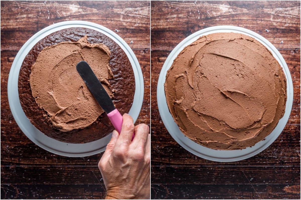 Frosting a vegan chocolate fudge cake on a white cake stand.