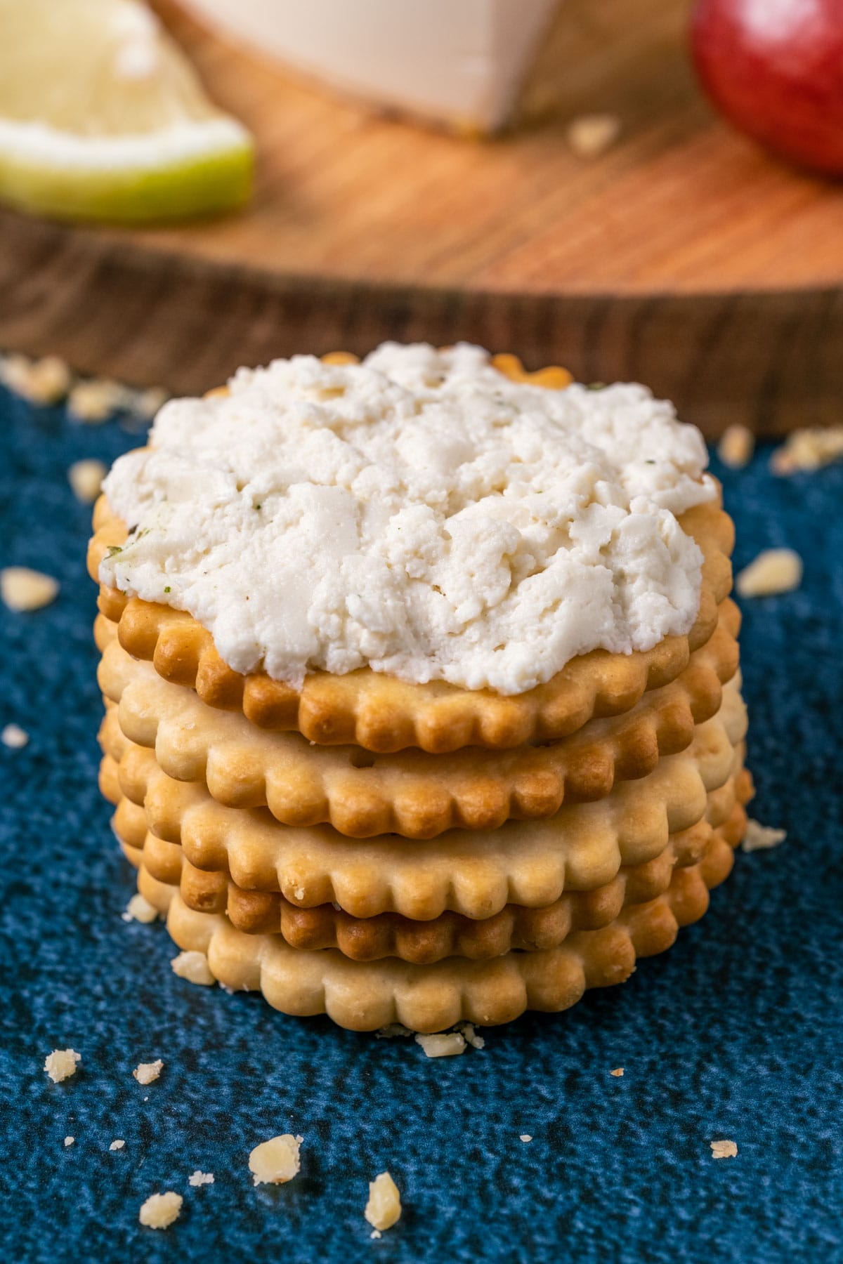 Vegan goat cheese mashed up on crackers.