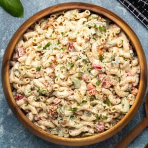 Vegan macaroni salad in a wooden salad bowl.