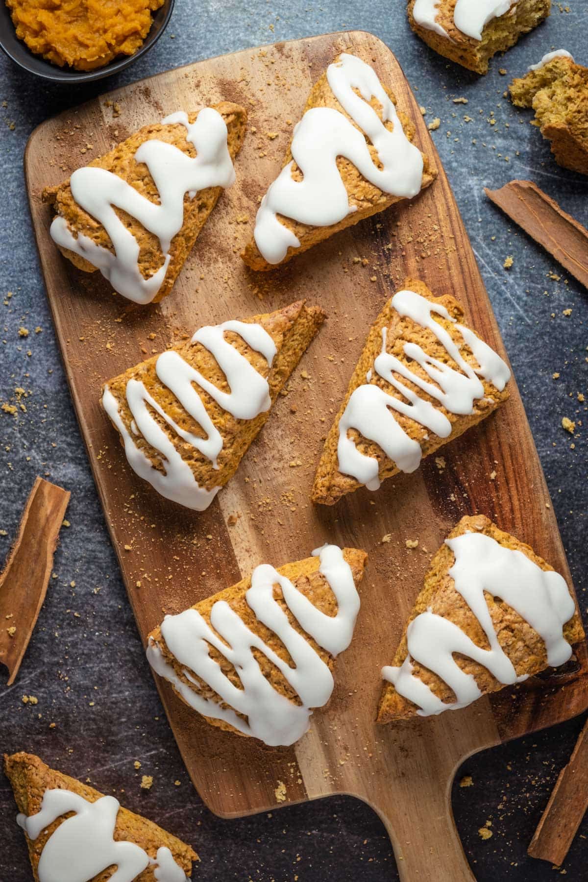 Vegan pumpkin scones on a wooden board. 