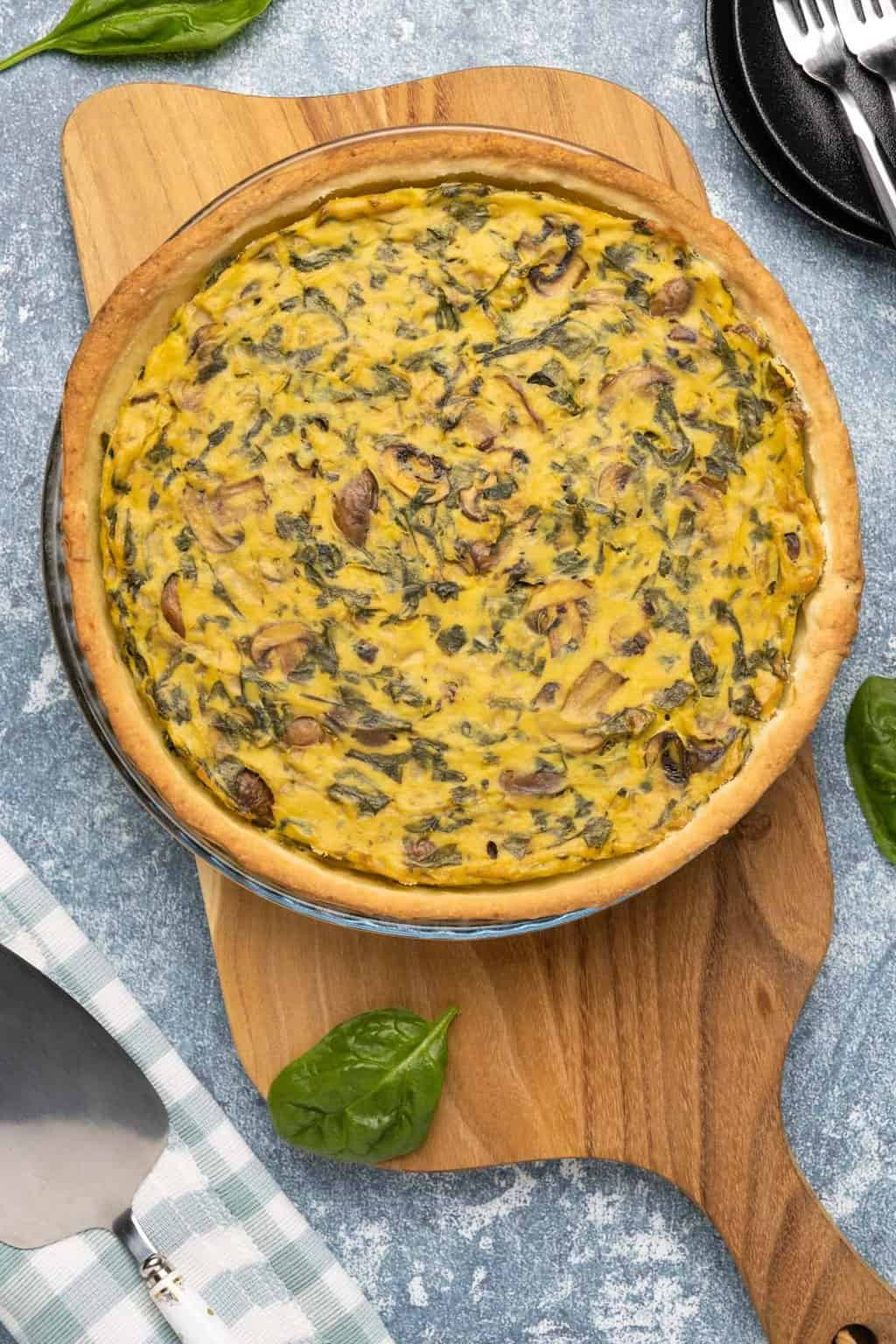 Vegan quiche in a glass pie dish. 