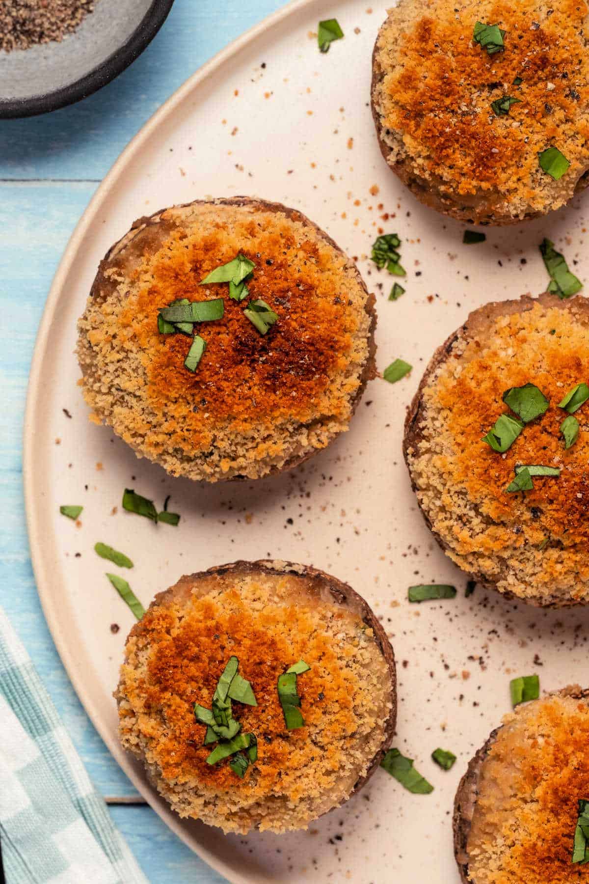 Stuffed mushrooms on a white plate.