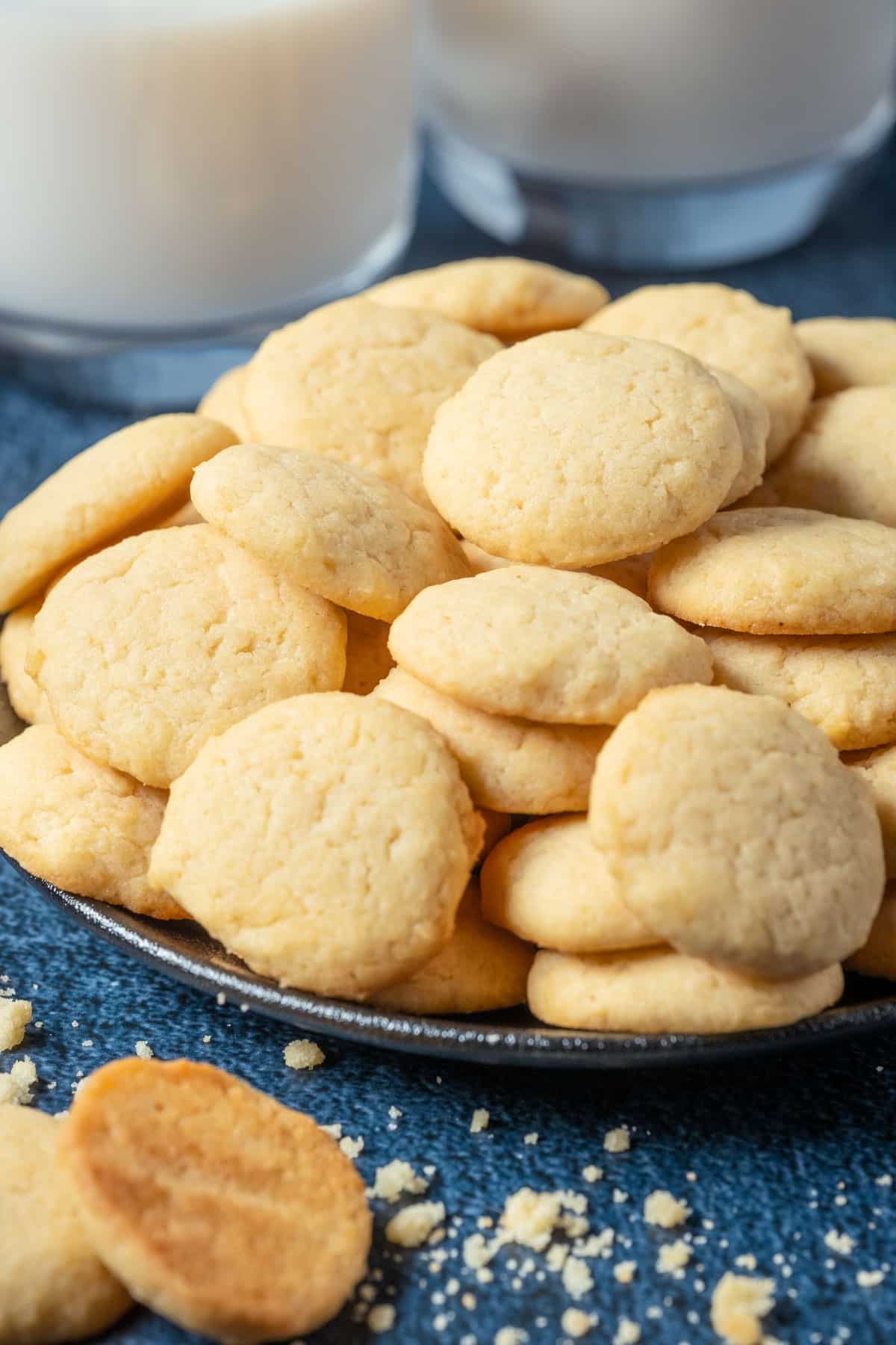 Vanilla wafers stacked up on a plate.