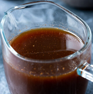 Vegan worcestershire sauce in a glass jug.