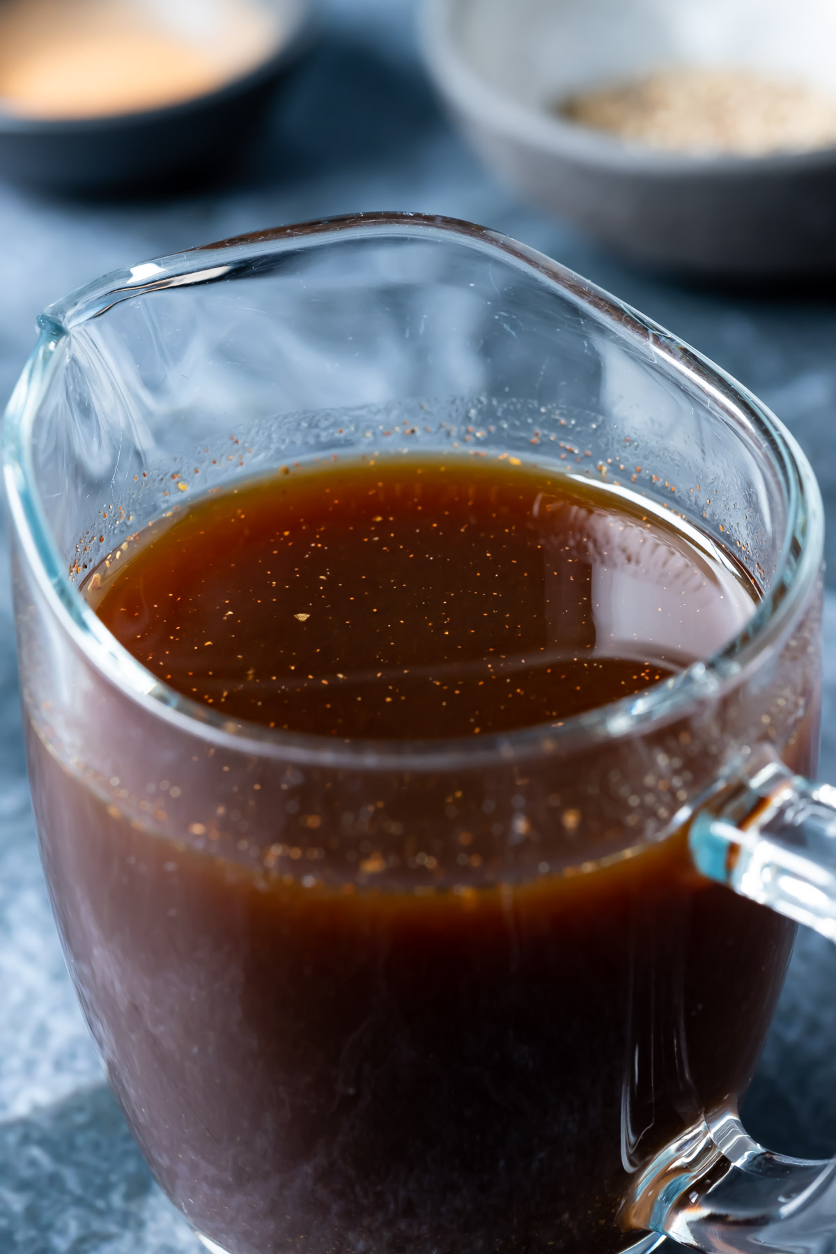 Vegan worcestershire sauce in a glass jug.